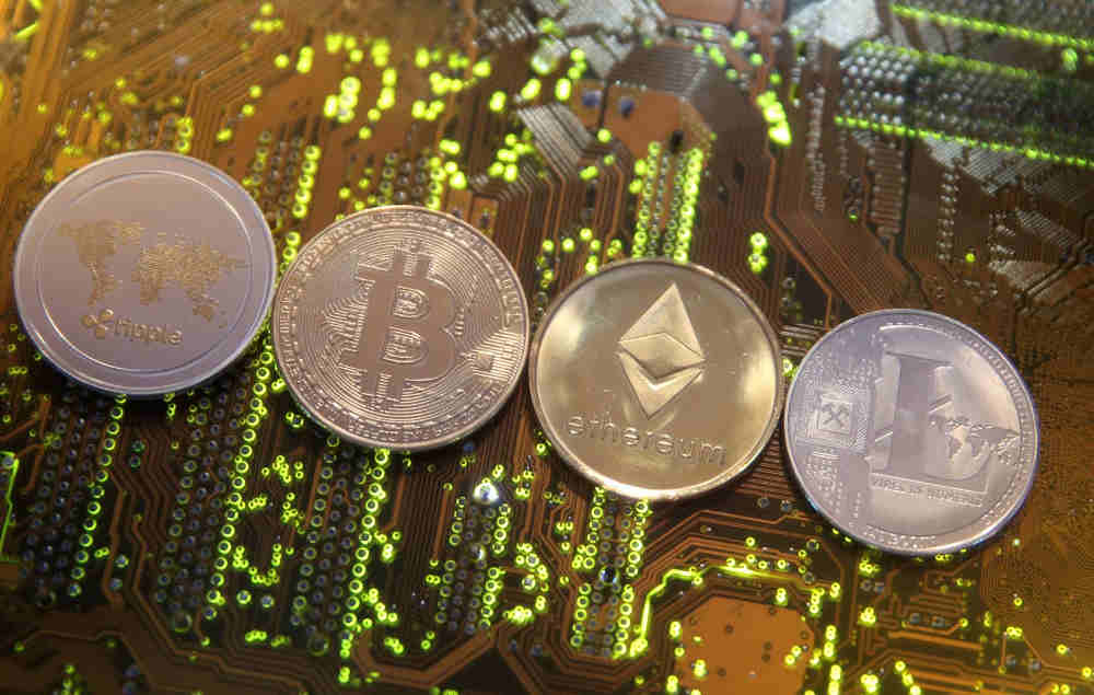 Crypto 'noobs' learn to cope with wild swings in digital coins | Reuters